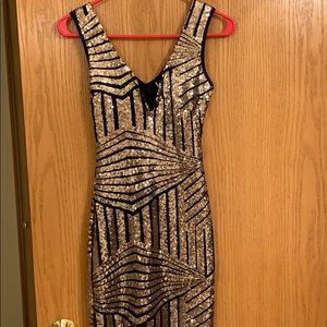 Black and gold sequence dress